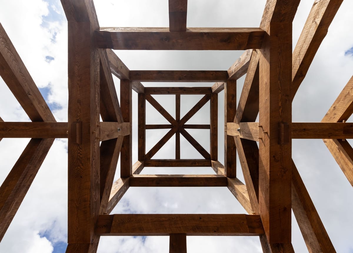 Ornate timber frame hip roof and cupola detail